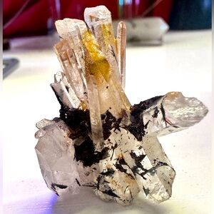 Crystal Quartz with hubnerite and golden healer inclusions